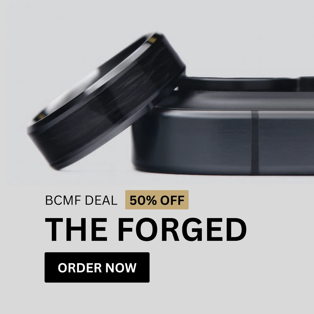 Close-up image of The Forged forged-carbon wedding ring displayed with a 50% off Black Friday offer.
