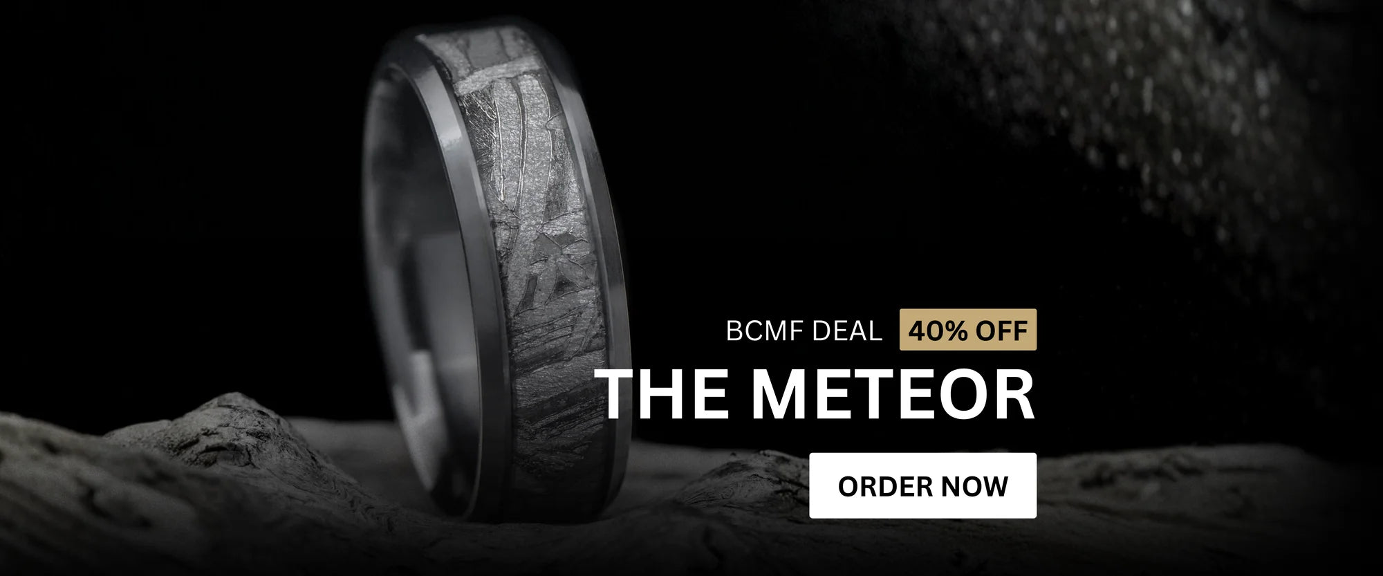 Close-up of The Meteor wedding ring featuring genuine meteorite inlay, shown with a 40% off Black Friday promotion.