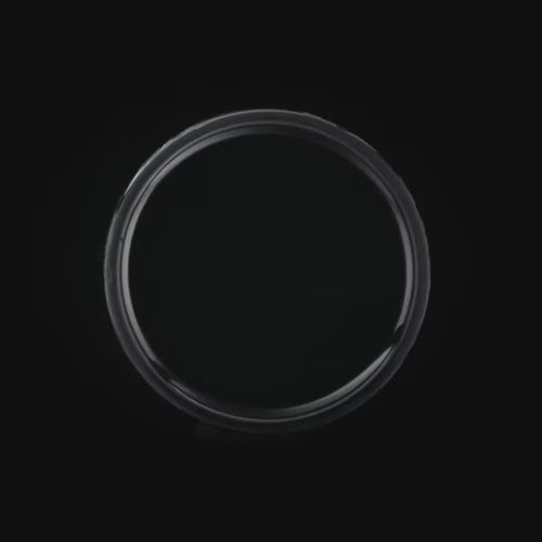 Black titanium mens wedding band with central moss agate inlay, featuring a unique hammered flat profile, 8mm width, free engraving available.